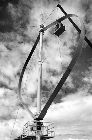 A Sandia team completes installation in the late 1980s of a vertical axis wind turbine test platform in Bushland, Texas