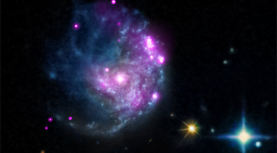 Chandra Discovers Intermediate-Mass Black Hole in Spiral Galaxy NGC 2276