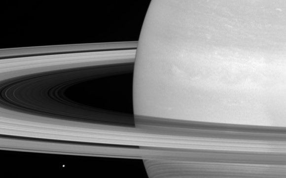 Cassini Sees Tiny Mimas Huge Rings