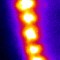 Excitons self organize into an ordered array