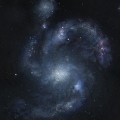 artist’s rendering of galaxy BX442 and its companion dwarf galaxy