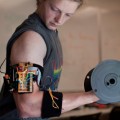 electronic trainer gives bulging biceps