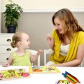 Mom Helping Child With Puzzle