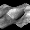 perspective view of a layered young crater in the Rheasilvia basin at Vesta