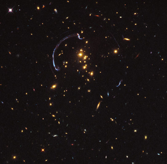 zoom lens in space gives close-up look at the brightest distant magnified galaxy