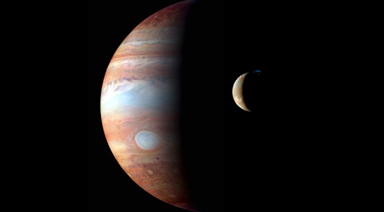 A Montage of New Horizons Images of Jupiter and its Volcanic Moon Io