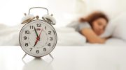 Alarm Clock Woman Sleeping in Bed