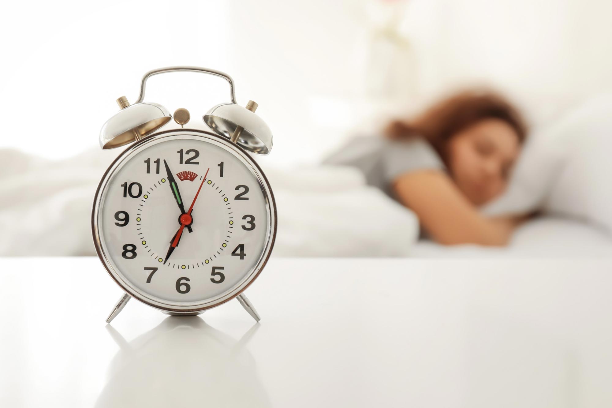Alarm Clock Woman Sleeping in Bed