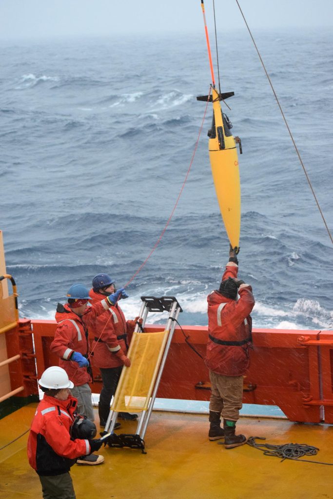 Antarctica Researchers Taking Mesurements