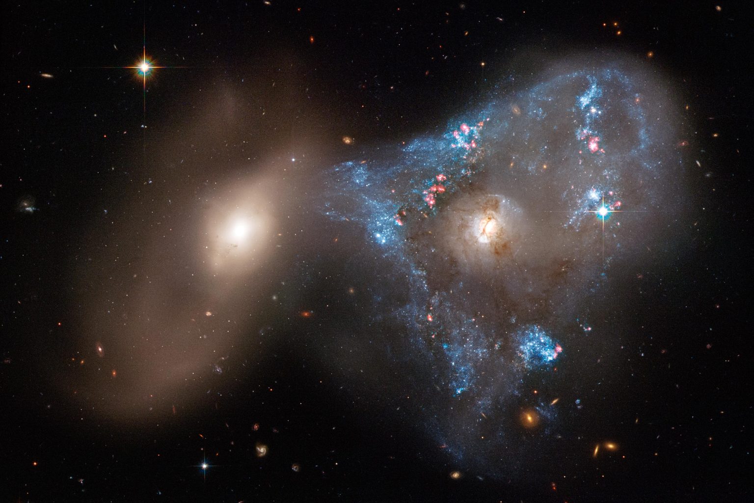 Head-On Collision Between Two Galaxies Creates a Tsunami of Starbirth Arp-143-1536x1024