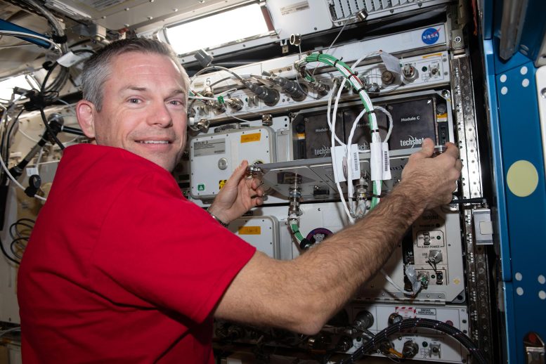 Astronaut Andreas Mogensen Replaces Computer Hardware in Research Gear