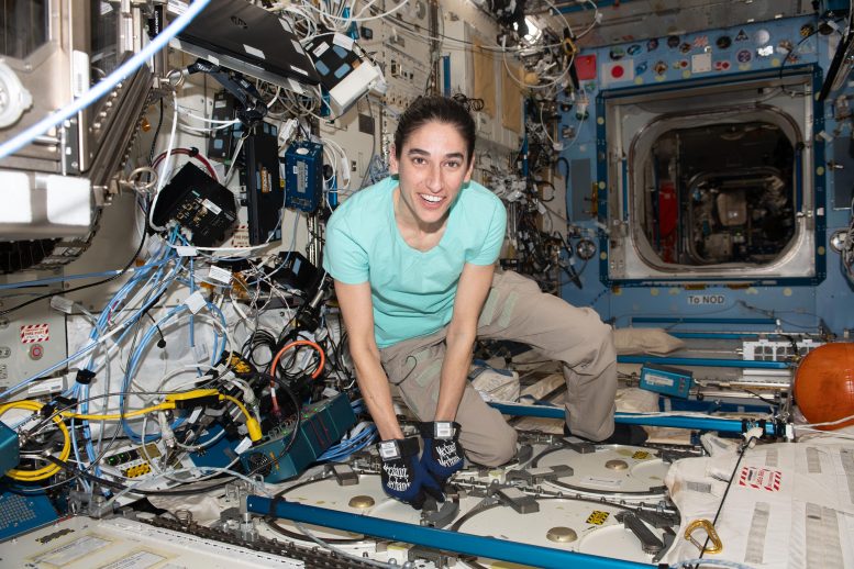 Astronaut Jasmin Moghbeli Opens Science Freezer That Hosts Research Samples