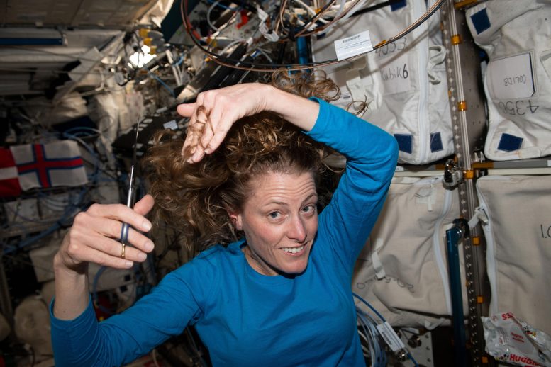 Astronaut Loral O’Hara Trimming Her Hair