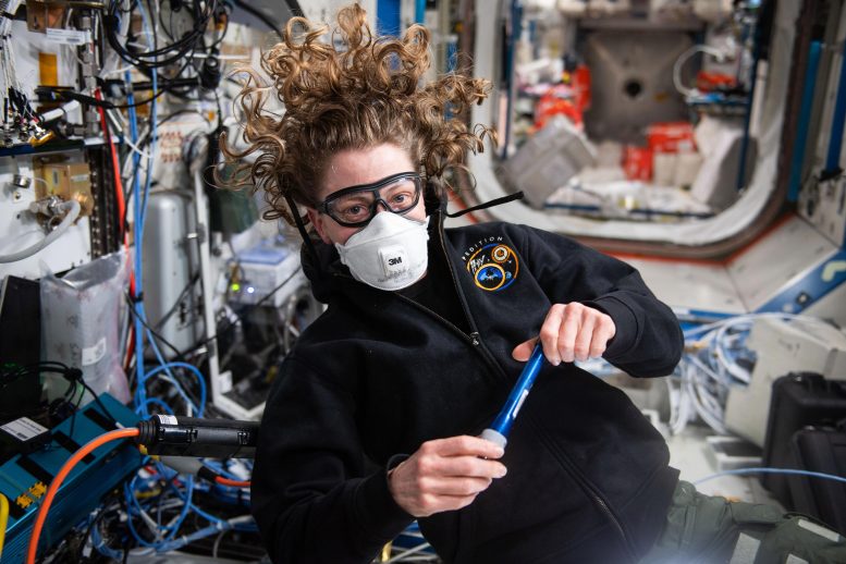 Astronaut Loral O’Hara Wears Personal Protective Equipment