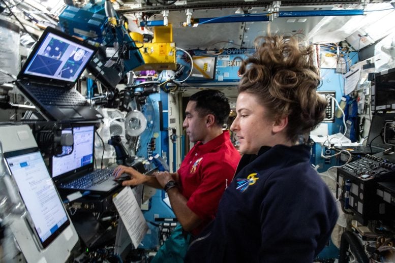 Astronauts Raja Chari and Kayla Barron Train on Robotics Workstation