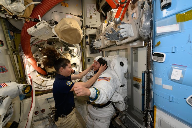 Astronauts Tracy C. Dyson and Mike Barratt During a Spacesuit Fit Check