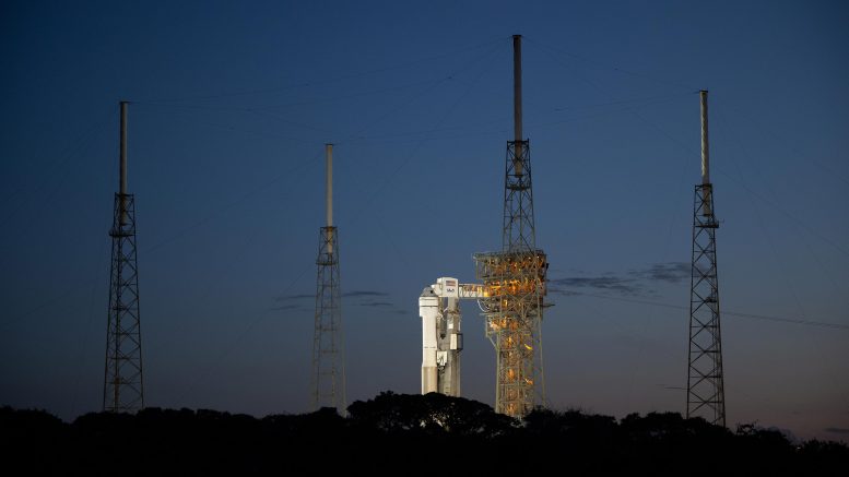 Atlas V Rocket With Boeing CST 100 Starliner Spacecraft Aboard on Launch Pad at Sunset