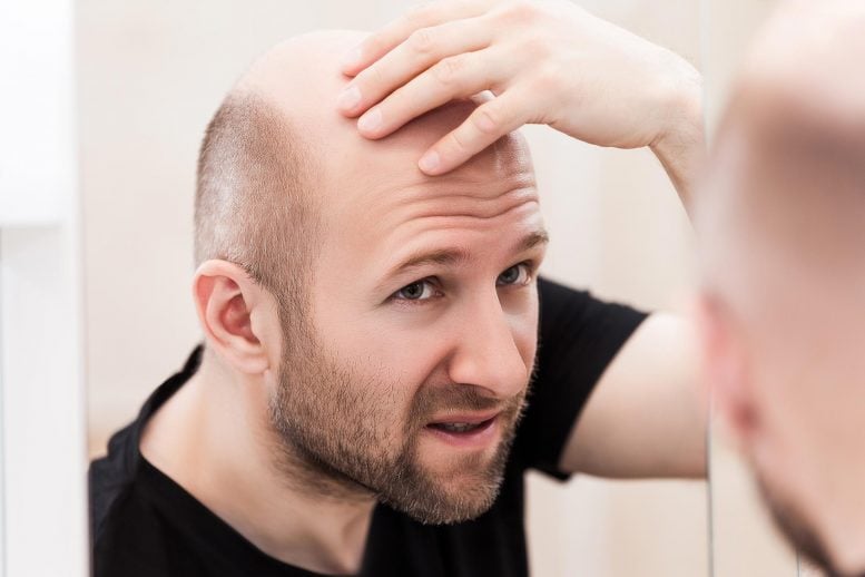 Bald Man Looking at Mirror
