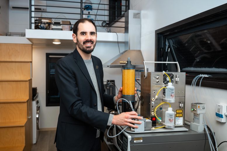 Brandon Boor Holding an Air Quality Device
