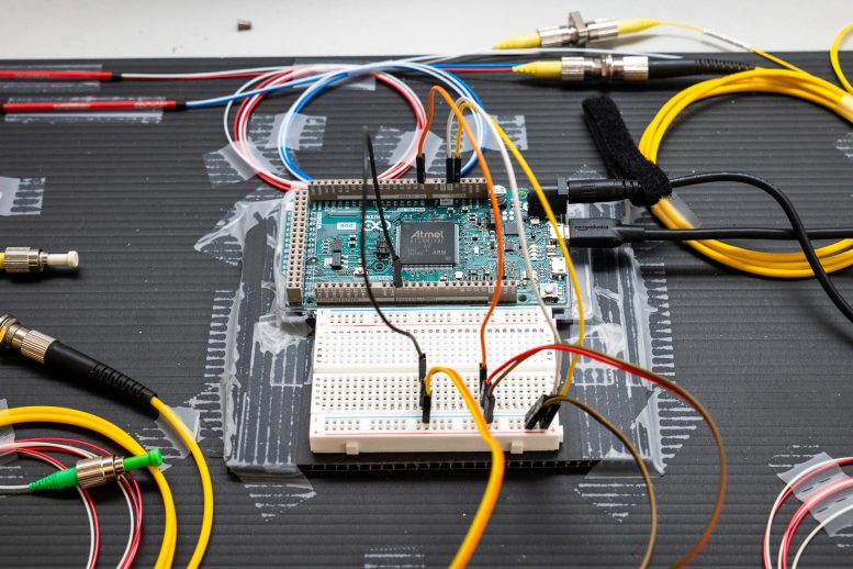 Breadboard and Circuit Board With Connected Fiber Cables