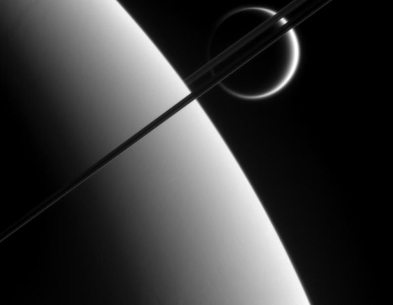 Cassini Gazes Upon Titan in the Distance Beyond Saturn
