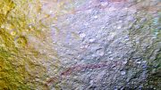 Cassini Spots Unusual Red Arcs on Icy Saturn Moon