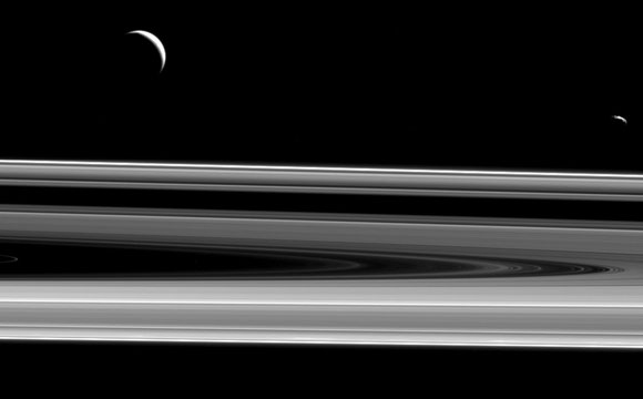 Cassini Views Moons Enceladus and Janus