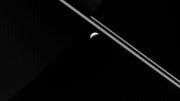 Cassini Views Saturn's Rings and the Icy Moon Enceladus