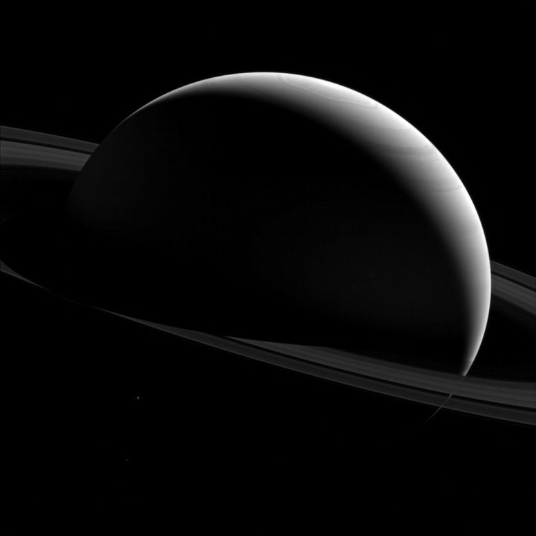 Cassini Views the Night Sides of Saturn and Tethys