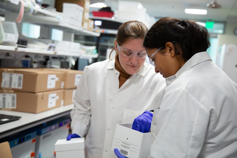 Christy Bennett and Pravina Venkatesan Preparing Research Samples in the Lab