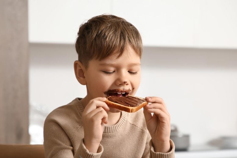 Cute Little Boy Eating Chocolate Toast