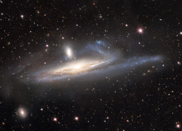Dark Energy Camera Captures Galaxies in Lopsided Tug of War
