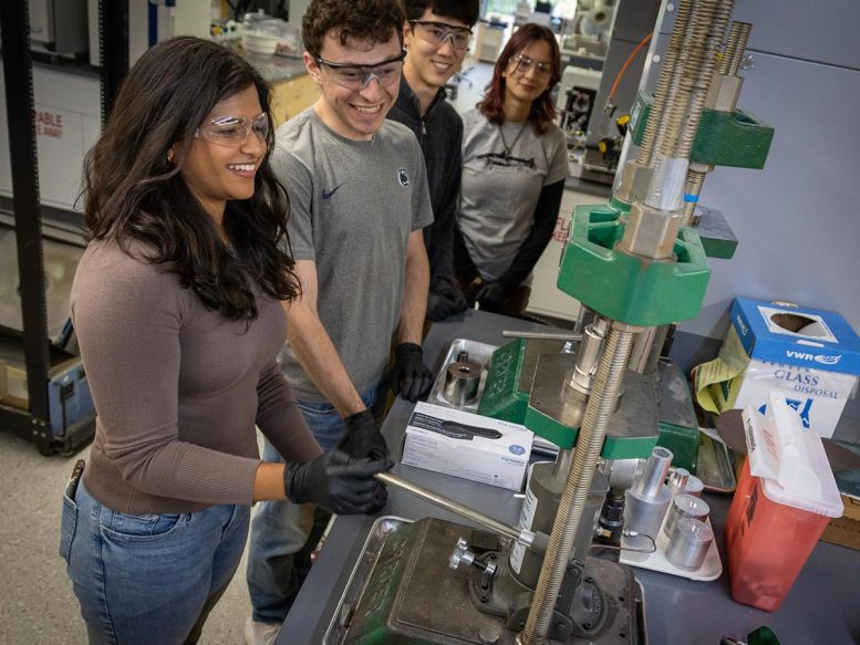 Dhiya Srikanth, Joseph Petruska, Matthew Furst and Kaylin Lamaute Work on Pressing a Ceramic Pellet