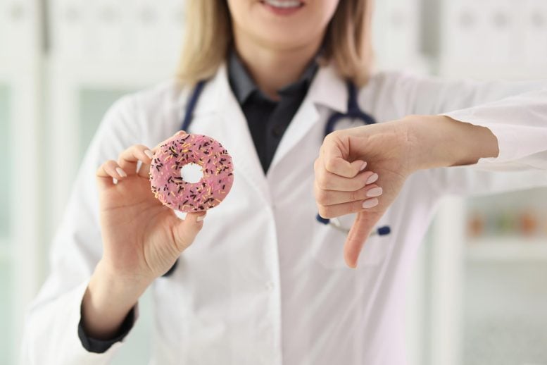 Dietitian Nutritionist Holding Donut Junk Food Thumb Down