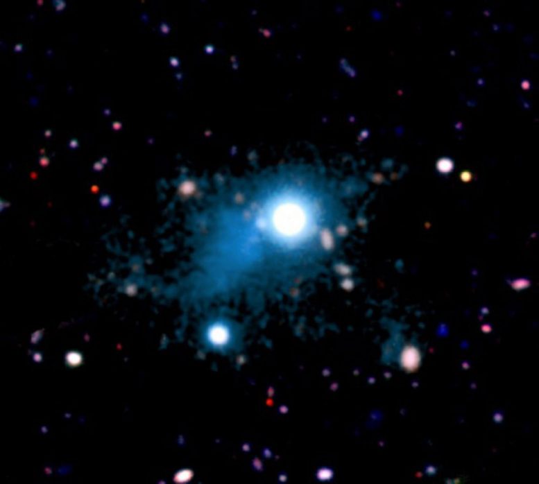 Distant Quasar Illuminates a Vast Nebula of Diffuse Gas