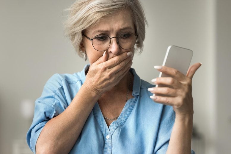Distressed Woman Smartphone Alarming News