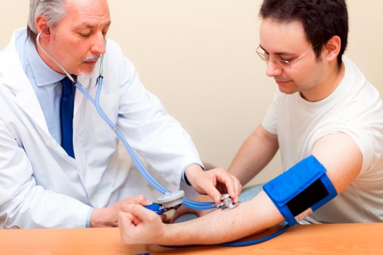 Doctor Checking Patient Blood Pressure