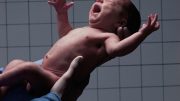 Doctor Holding Newborn Baby