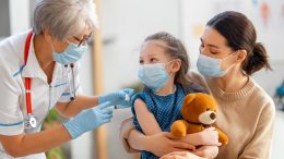 Doctor Vaccinating Child