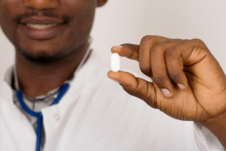 Doctor With Stethoscope Holding White Pill Medicine