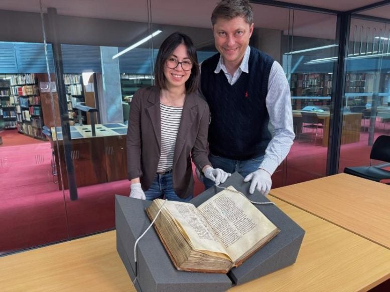 Dr Elisabetta Magnanti and Dr Mark Faulkner With the Trinity Copy of Bede’s Ecclesiastical History