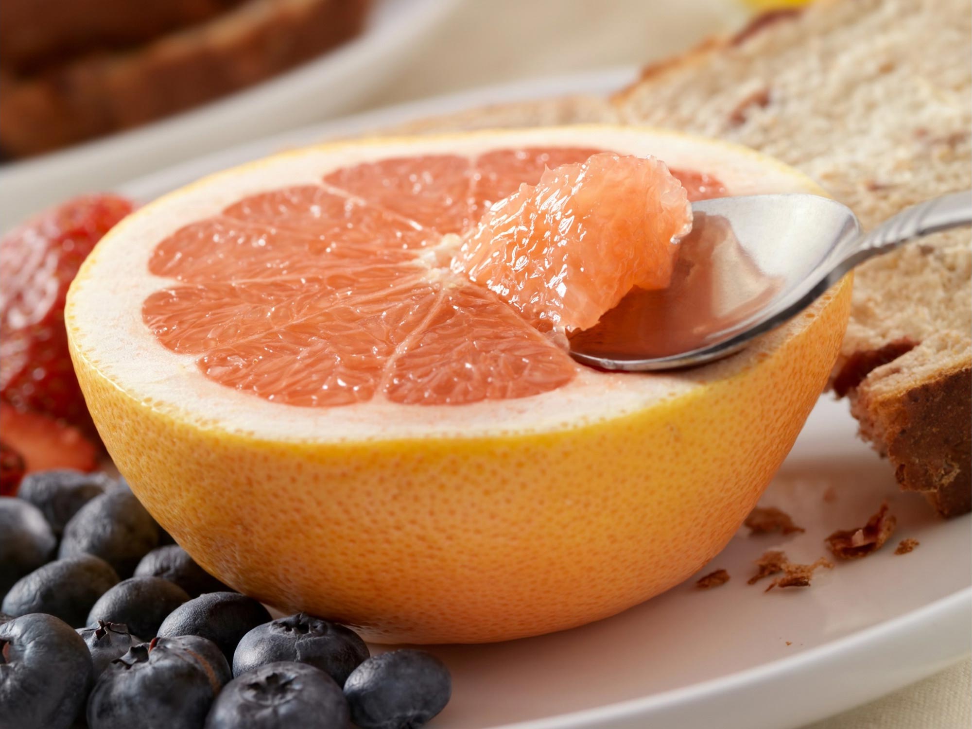 Eating Grapefuit Breakfast