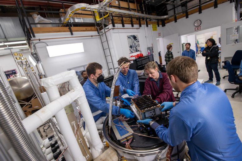 Engineers Attach BurstCube to Thermal Vacuum Chamber Platform
