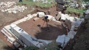 Excavated Building With Semi Circular Interior Stone Wall