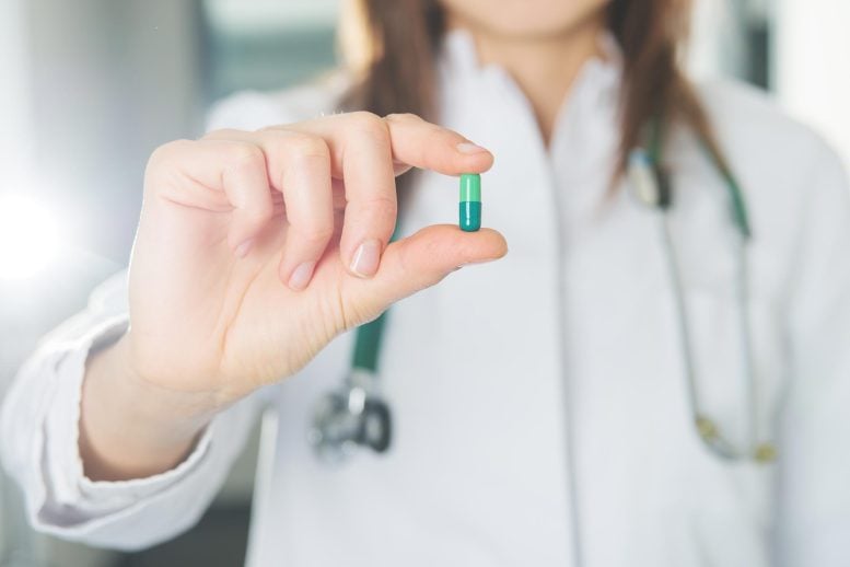 Female Doctor Holding Pill Capsule New Medicine