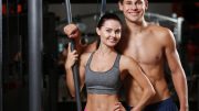 Fit Young Couple Posing at Gym