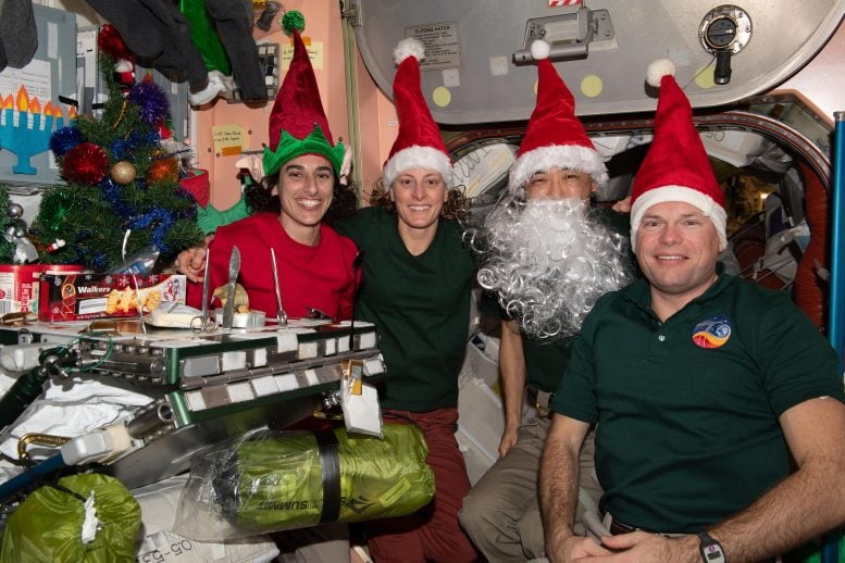 Four Expedition 70 Crewmates Christmas Eve Portrait