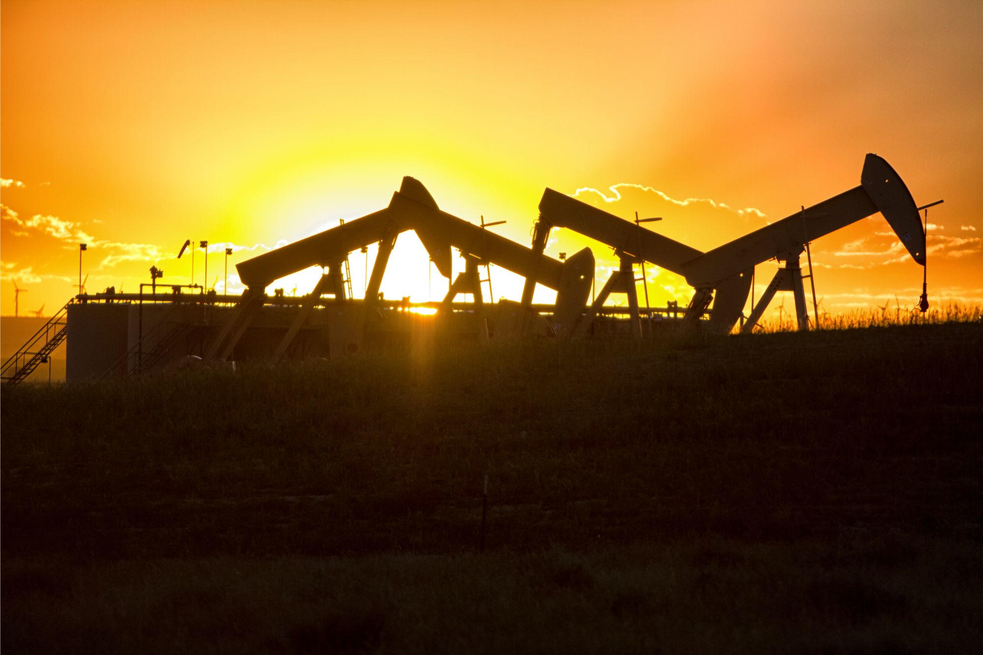 Sunset over hydraulic fracturing oil well