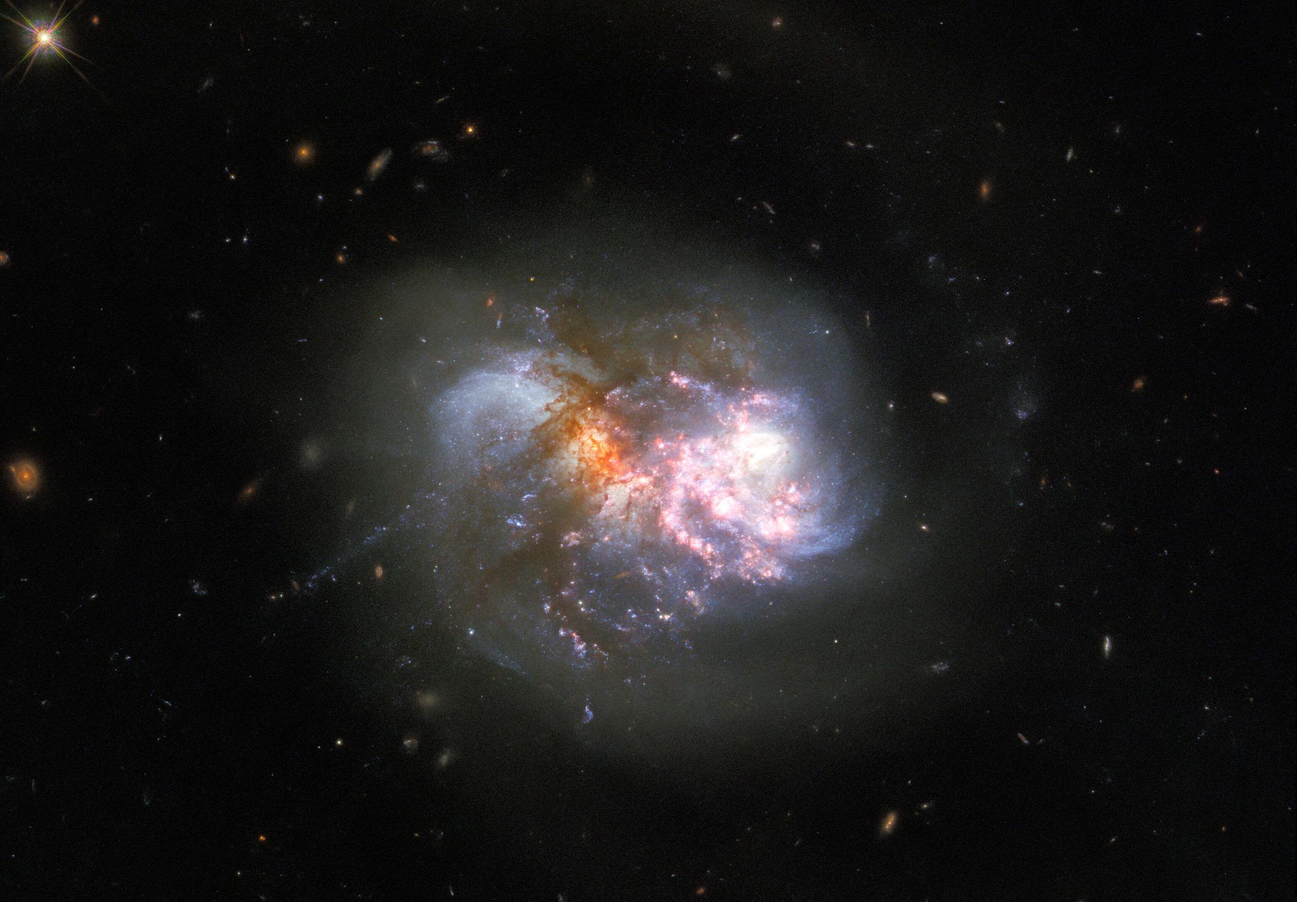 Clash of the Titans: Hubble Spots a Cataclysmic Cosmic Collision - SciTechDaily