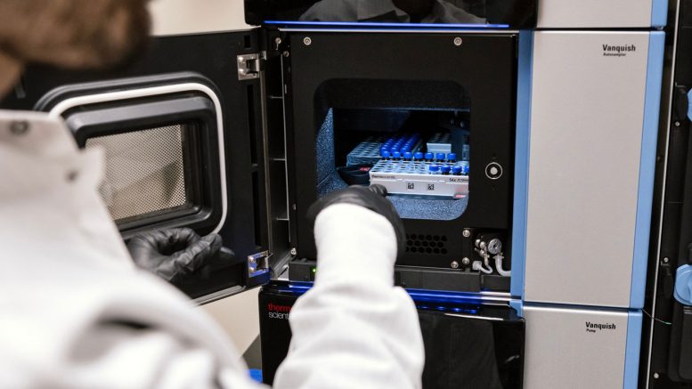 Gladstone Scientist Loading Samples for Vitamin Disease Study